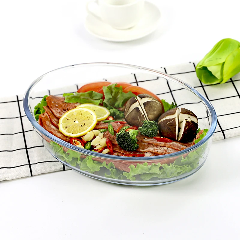 Oval clear glass dish with food in a tabletop setting