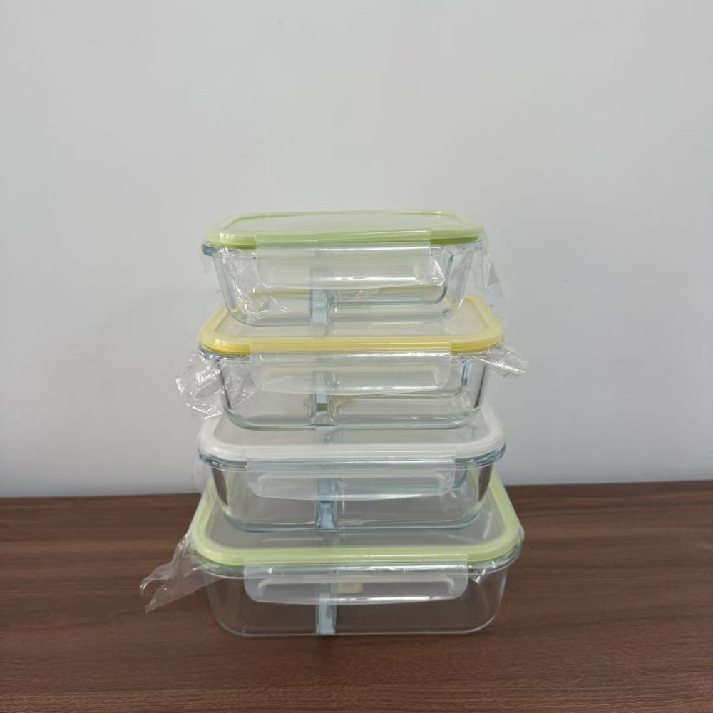Stacked divided glass containers with coloured plastic lids