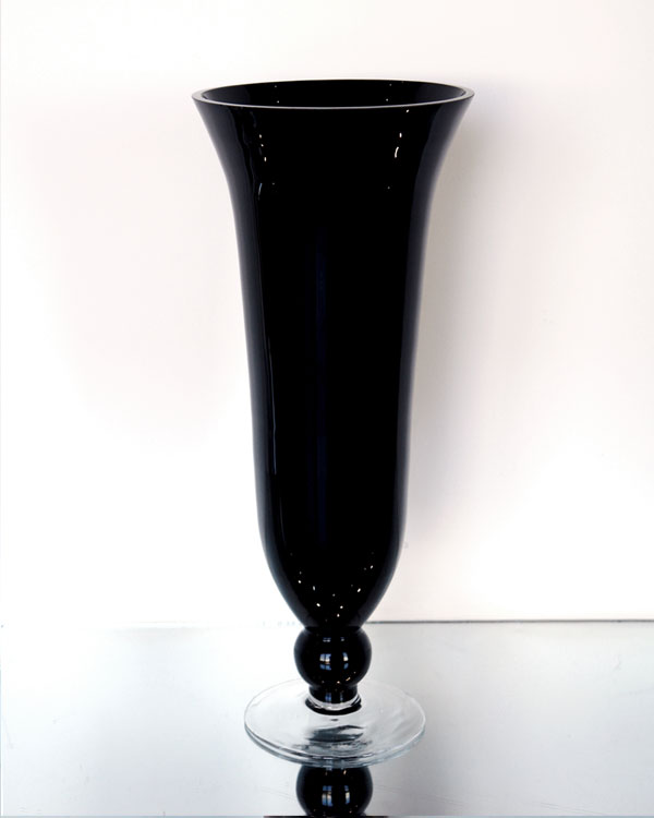 Dark opaque-looking footed glass vase