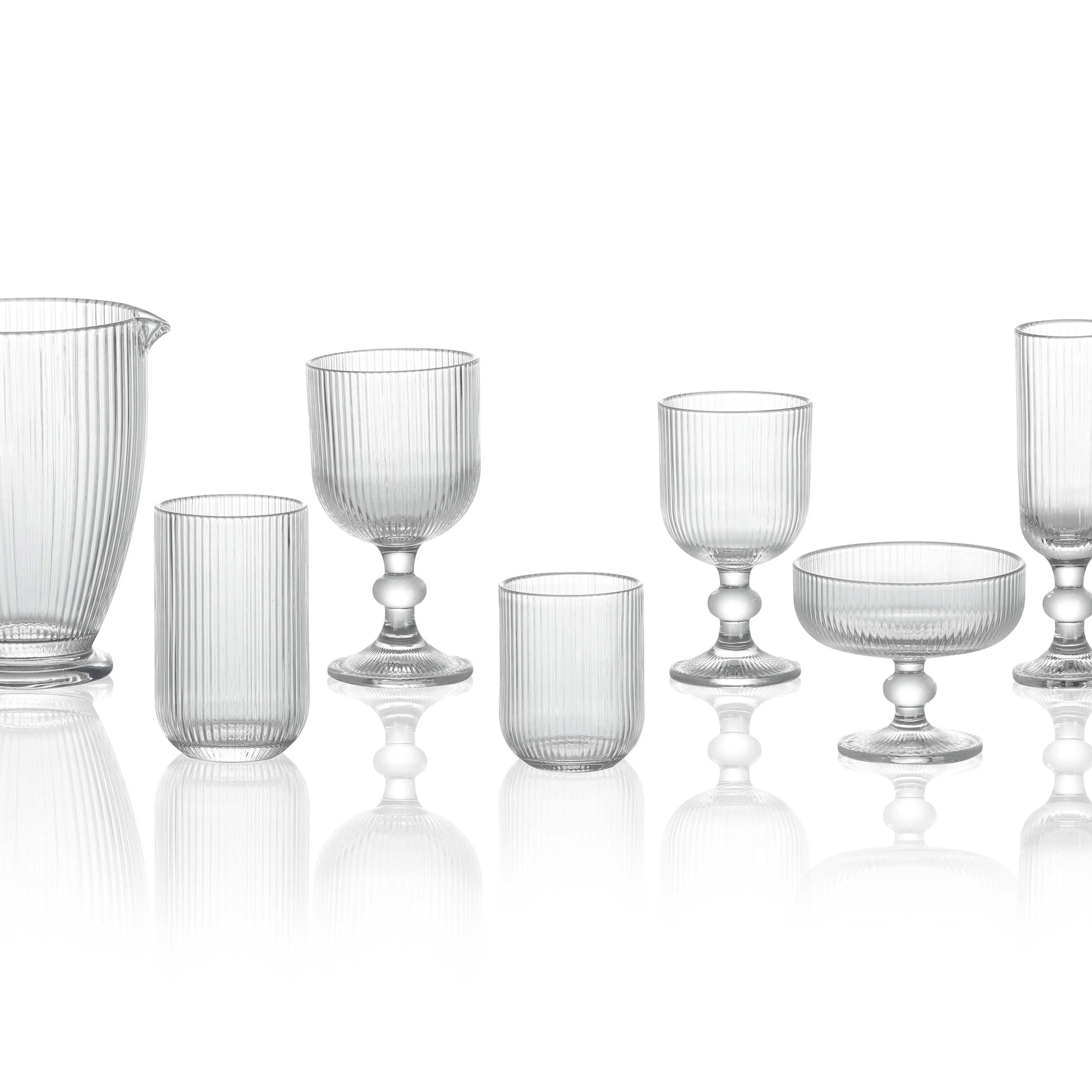 Clear ribbed pitchers, drinking vessels and footed serving forms