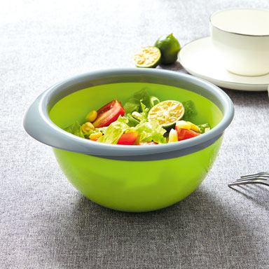 Two-colour bowl holding prepared salad
