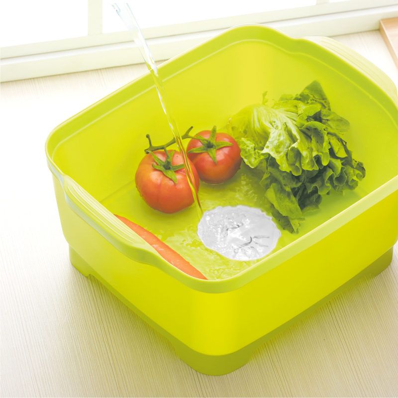 Rectangular vegetable basin at a sink