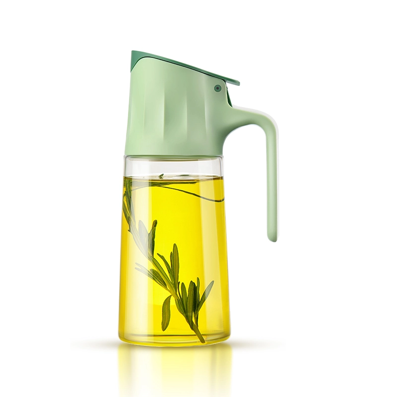 Glass oil dispenser with a pale-green gravity-opening lid and handle