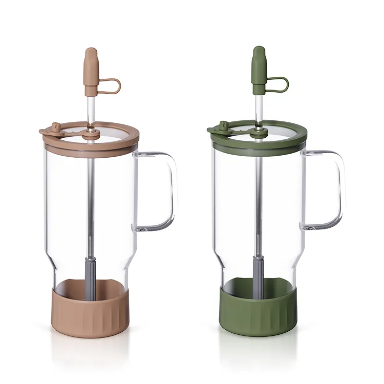 Two clear handled glass tumblers with lids and straws
