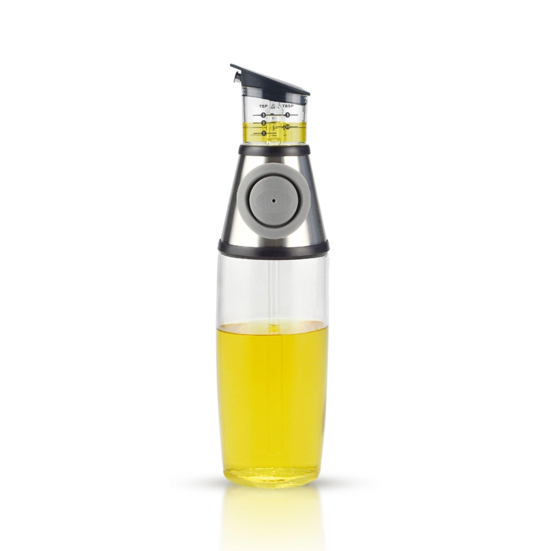 Glass oil bottle with a pump button and marked measuring chamber