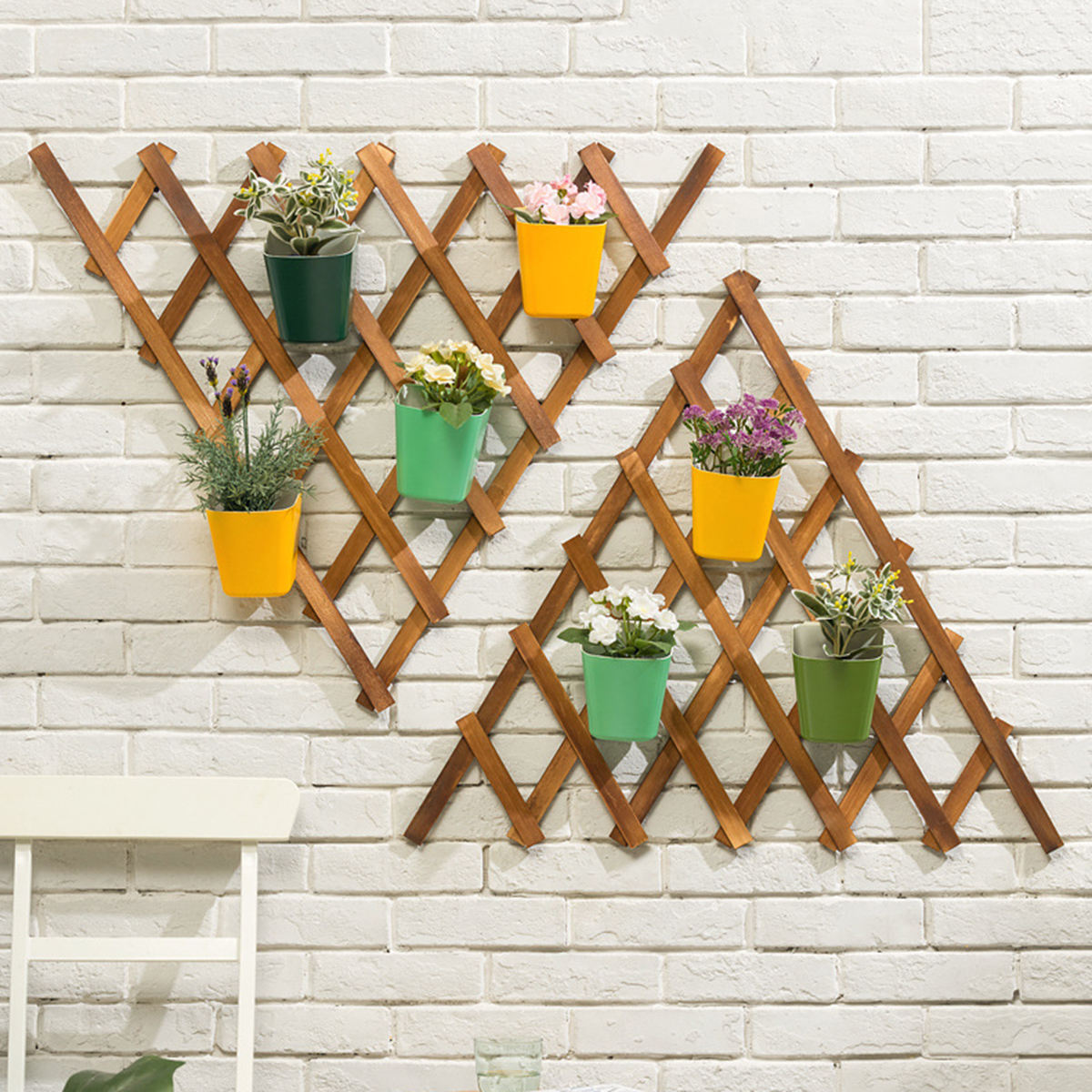 Lattice-style wall plant display with hanging pots