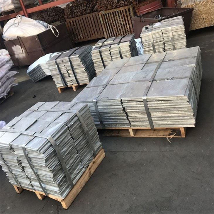Stacks of plain square metal plates