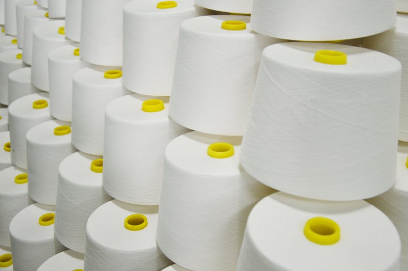 Unmarked white yarn packages