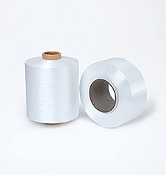 Unmarked filament yarn packages on a plain background